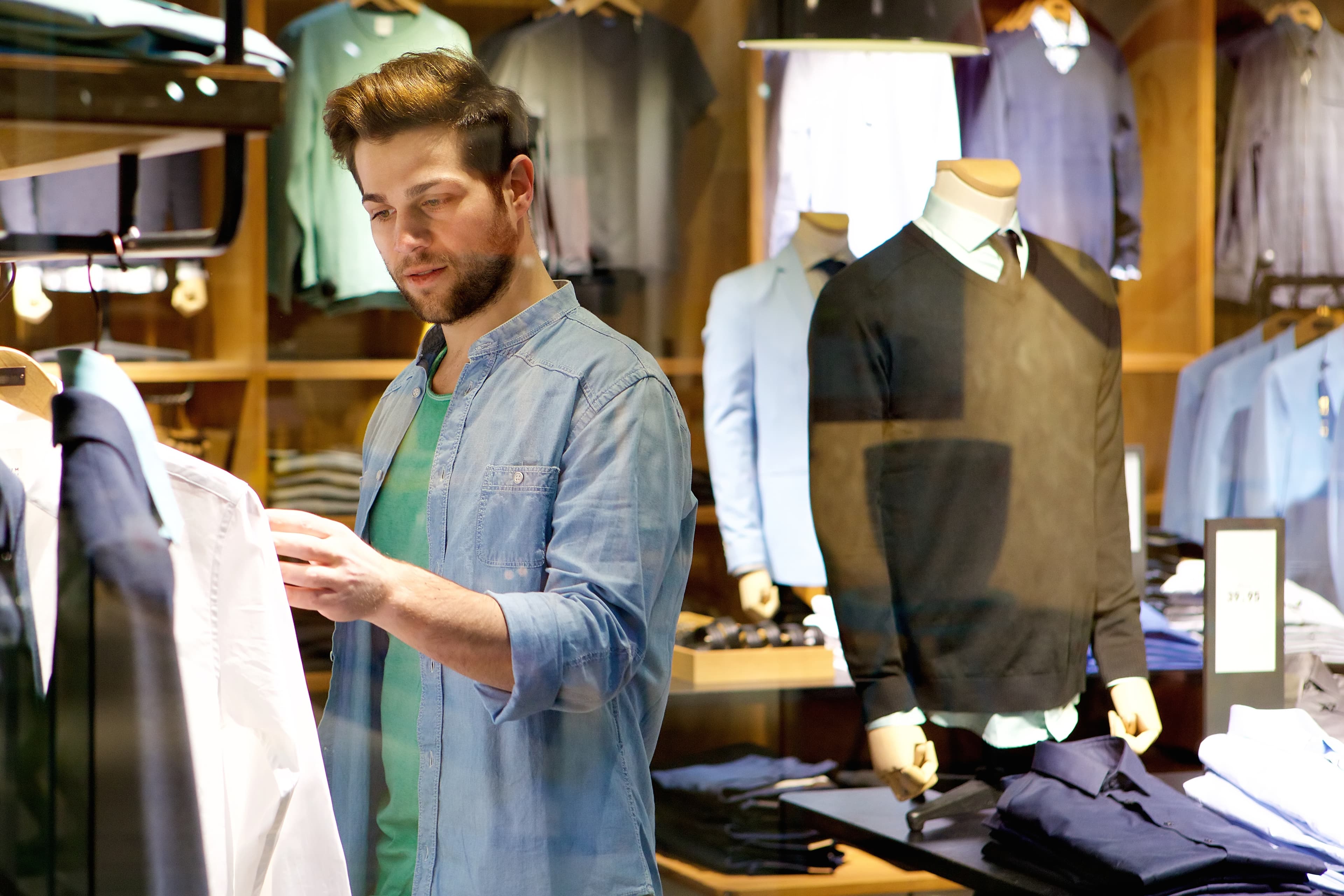 man shopping in clothing store