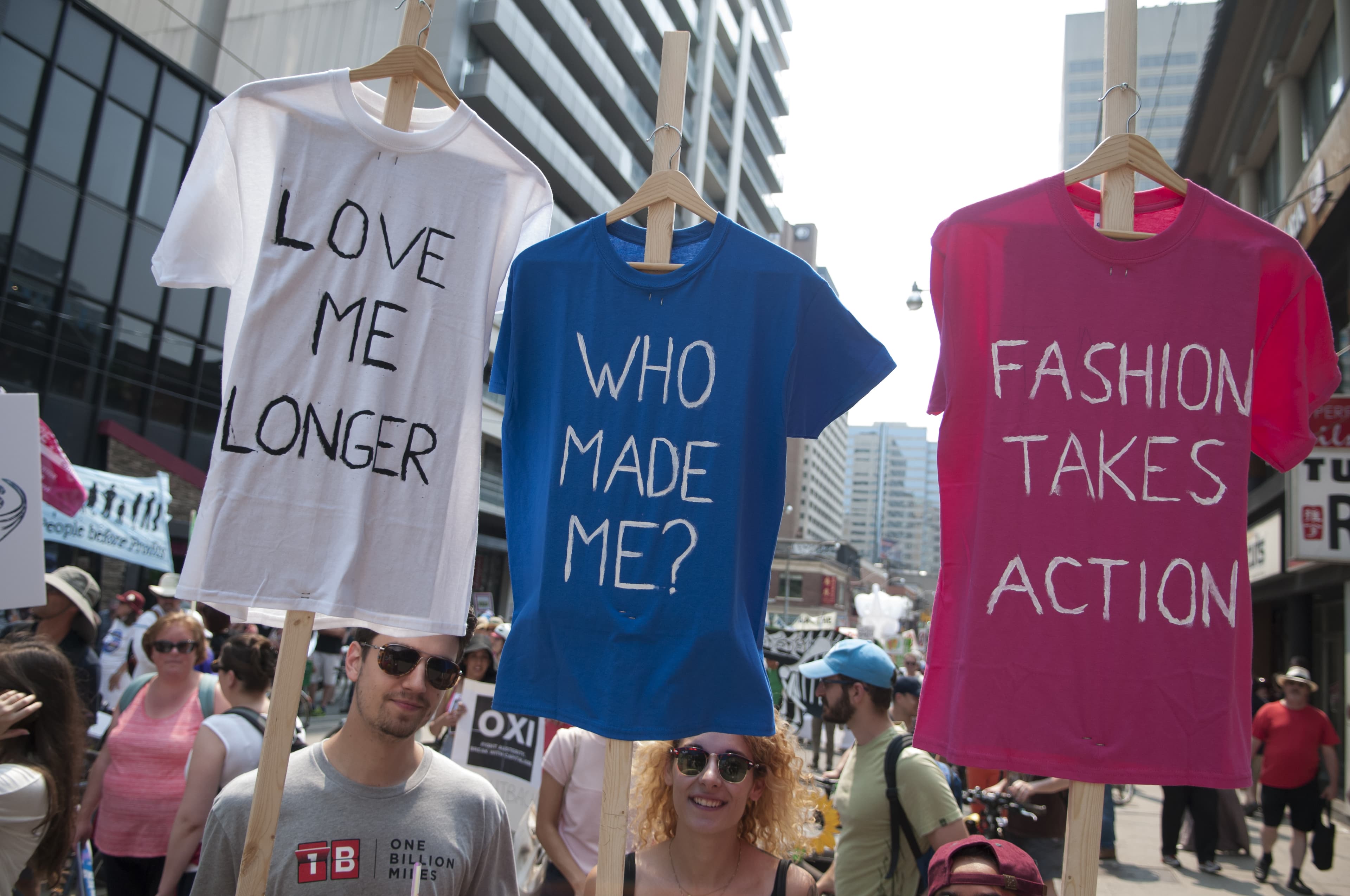 people protesting against the fashion industry's effect on the environment